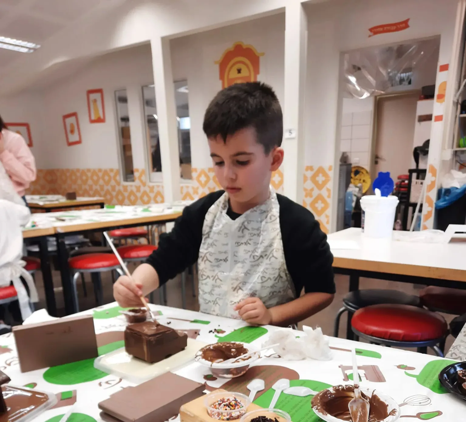 Young artist working with paint and materials